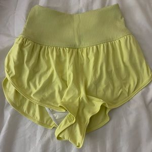 Yellow free people game time shirts